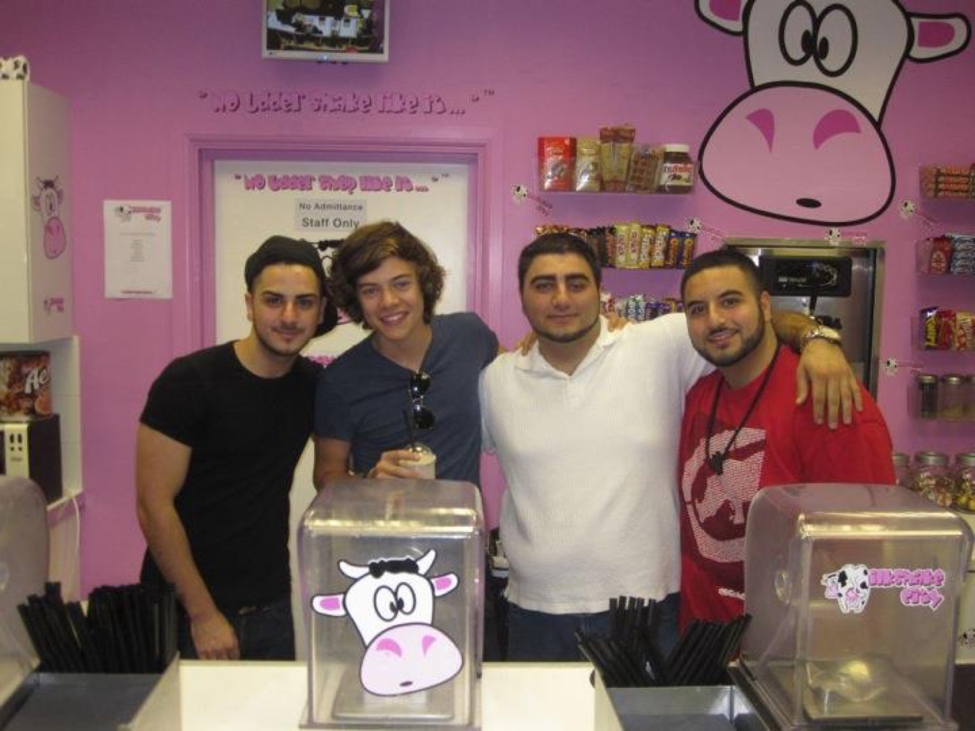 Harry Styles behind the Milkshake City counter with three members of staff